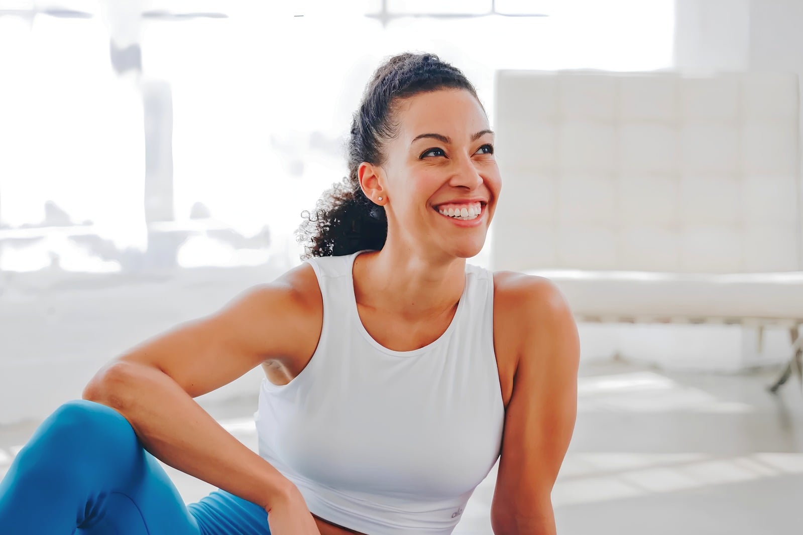 Axis Fitness — smiling woman in activewear