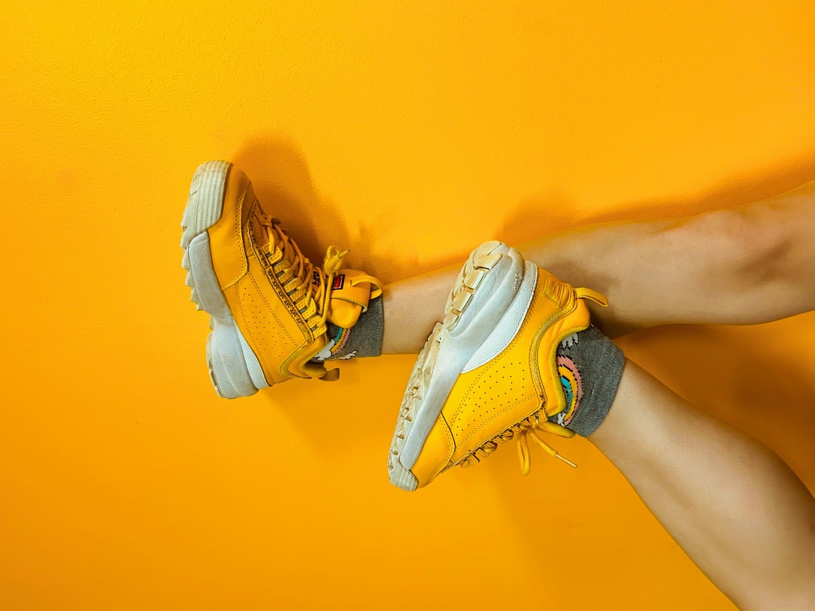 Blocktone — yellow sneakers on an orange backdrop