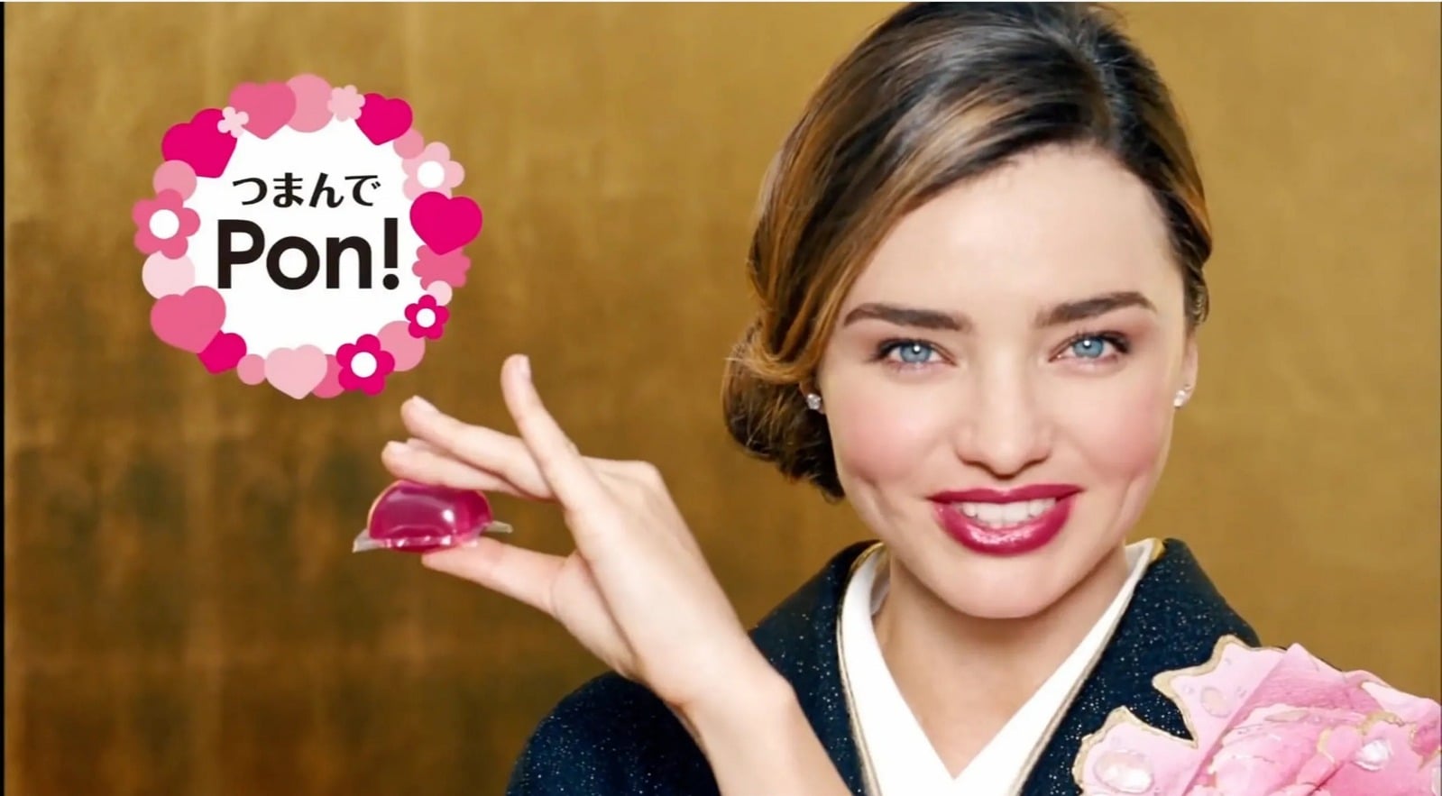 Miranda Kerr holding a detergent gel ball for P&G Bold