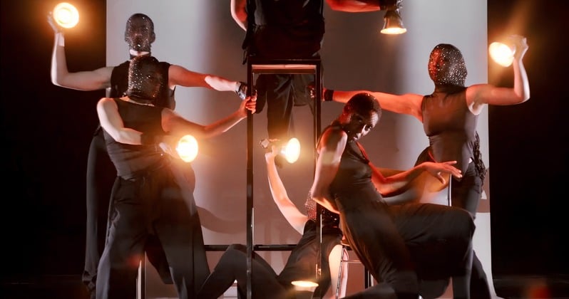 After Hours — dancers holding warm practical lights