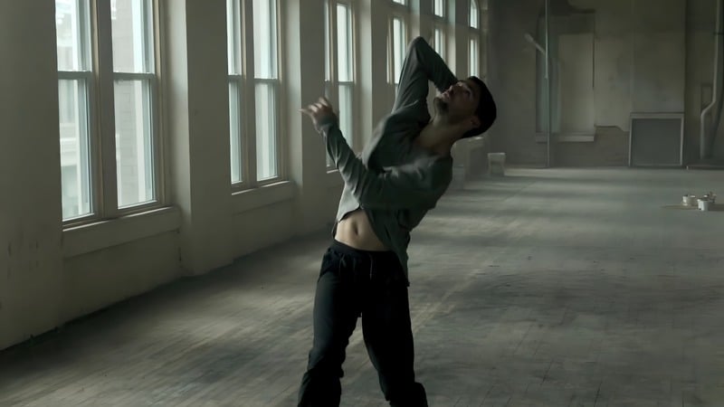 Better — dancer mid-movement in a sunlit loft