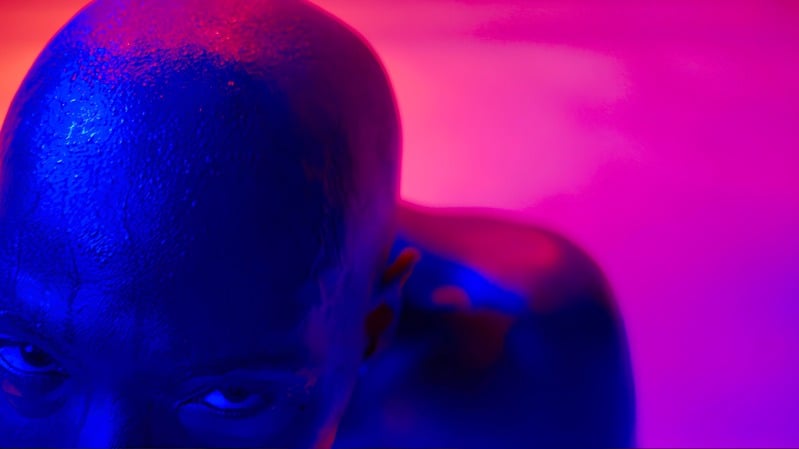 Chromatic — portrait washed in blue and pink light